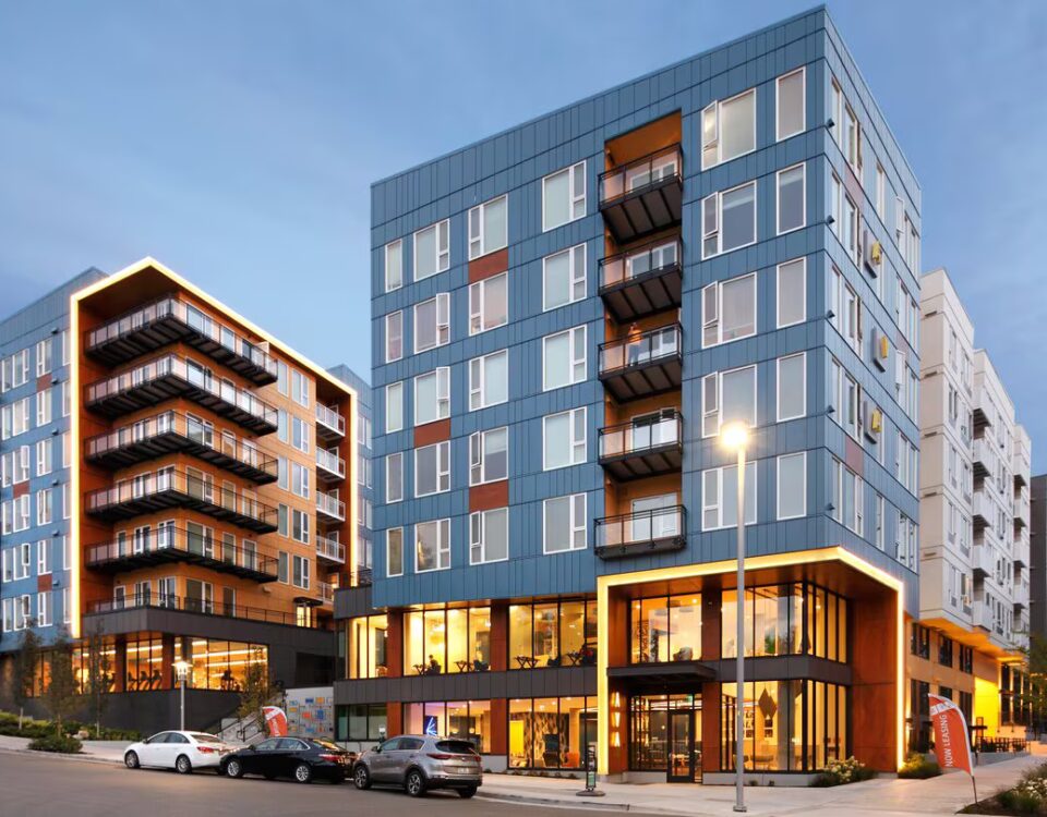 Avalon Estera 8 exterior shot during the evening highlighting the custom balconies and railings