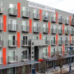 Custom Juliet balconies and tube frames at Harborside Flats in Bremerton, WA