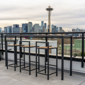 Custom double-top glass railing on rooftop patio in Queen Anne