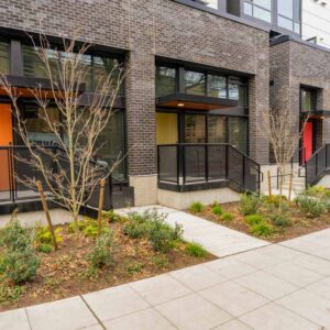 Metal railings with sun shade and porches on first level apartments