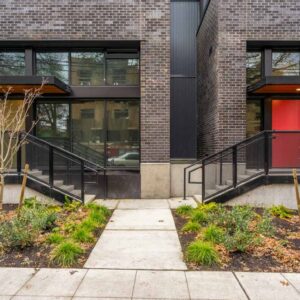 Metal railings with sun shade examples on first level apartments