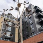 Glass railing on balconies of multifamily apartment complex