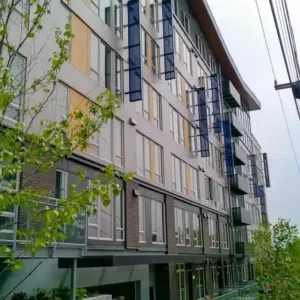 Aesthetic vertical sun shades on the side of 68th and 8th apartment complex