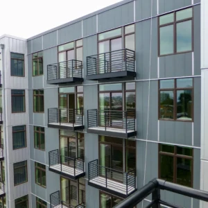 Horizontal metal railings on apartment complex's balconies