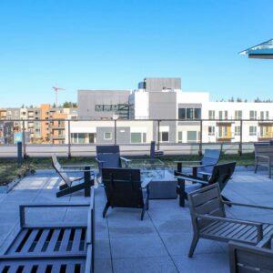 Custom framed glass railing on rooftop patio with custom glass sun shade