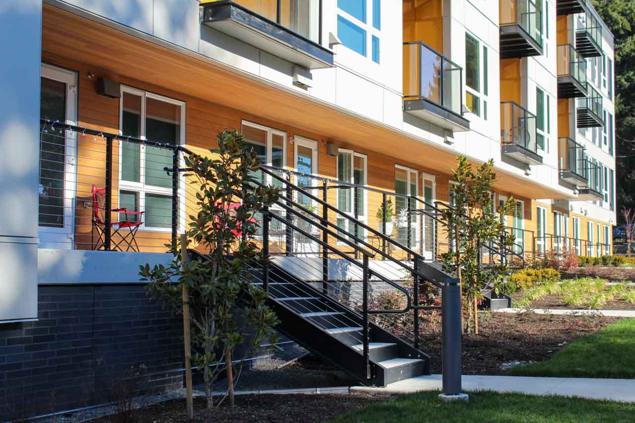Custom glass railings with balconies and single-top cable railings for stair guardrails